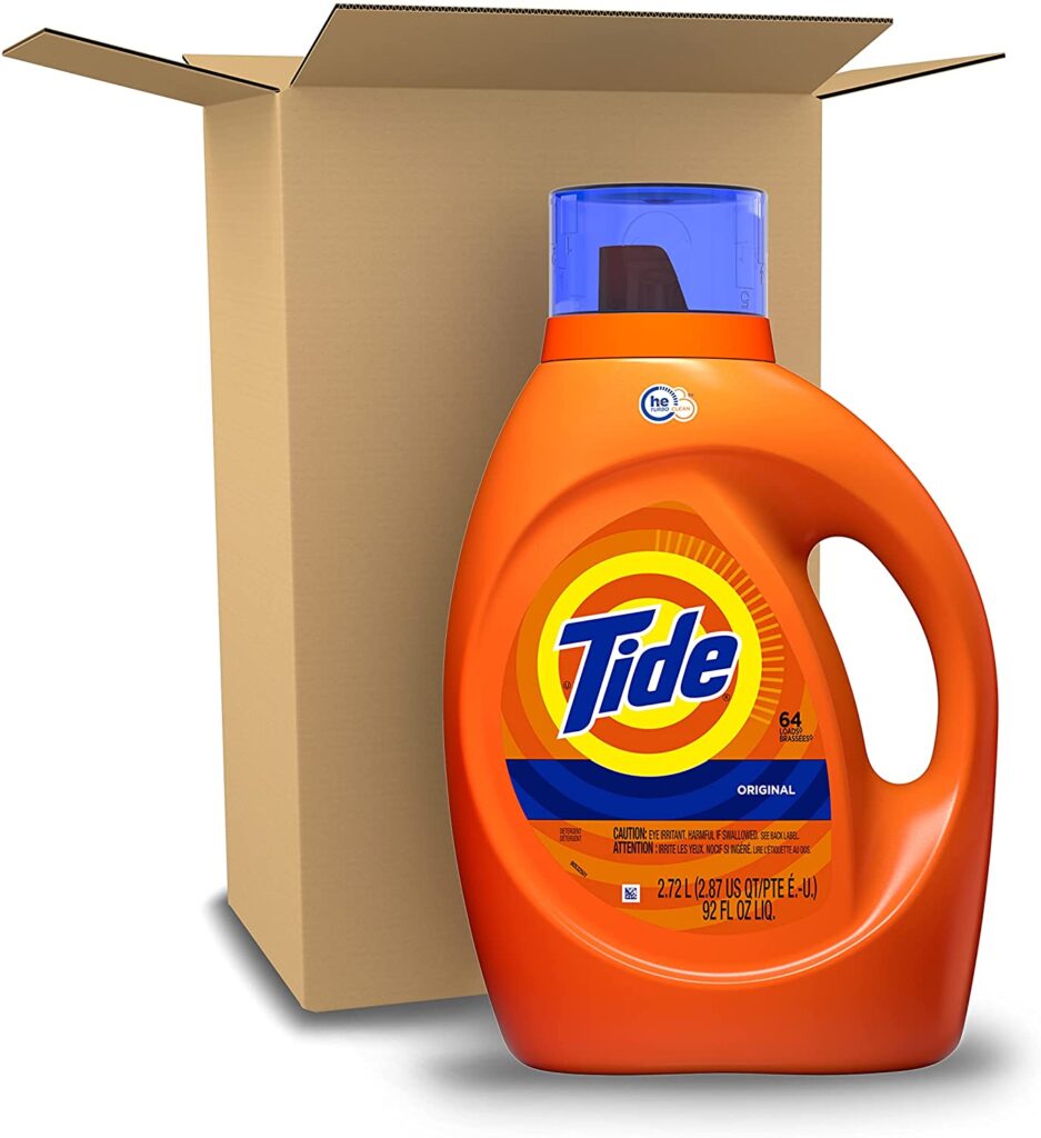 bottle of tide detergent next ot a box