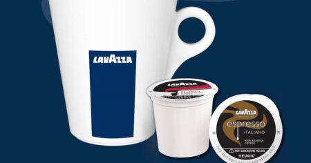lavazza k-cups next to a coffee cup