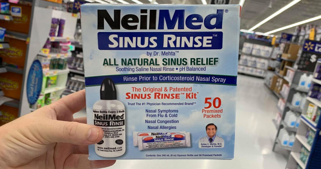 hand holding neilmed sinus rinse kit