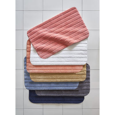 stack of bath rugs