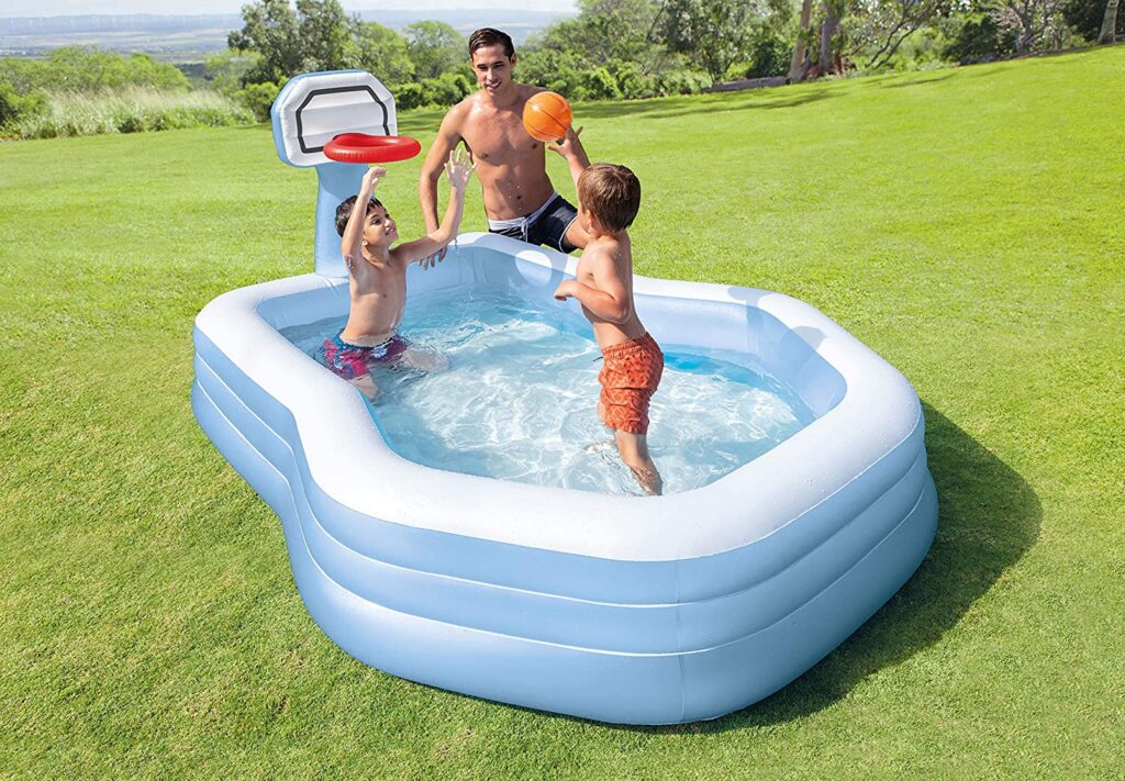 family swimming in inflatable intex pool