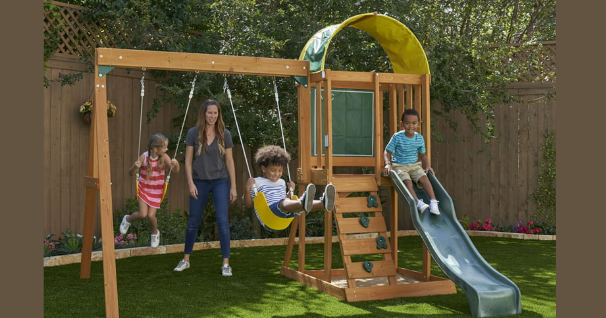 KidsKraft Ainsley Wooden Outdoor Swing Set with Slide, Chalk Wall