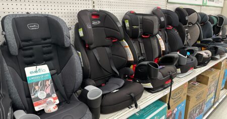 row of carseats on a shelf at a store