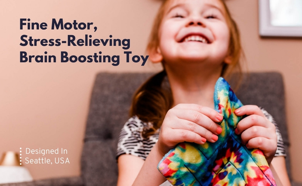 girl holding a fabric maze mat