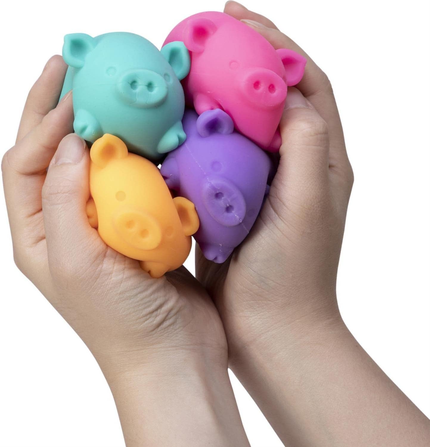 two hands holding colorful Needoh pigs