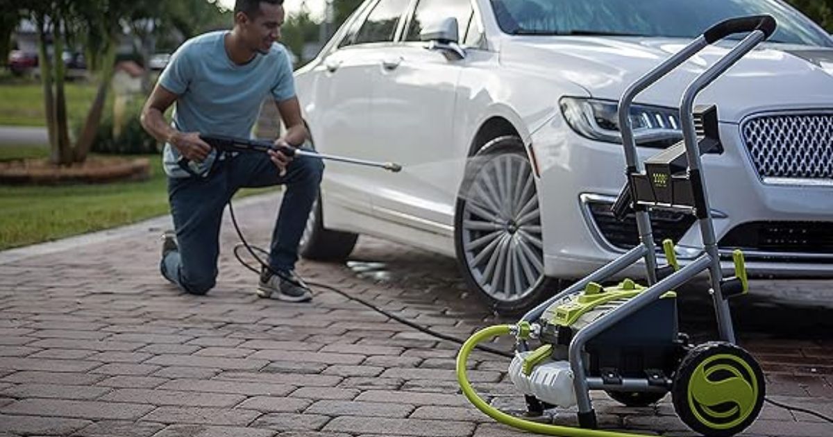 Pressure Washer man washing car with pressure washer