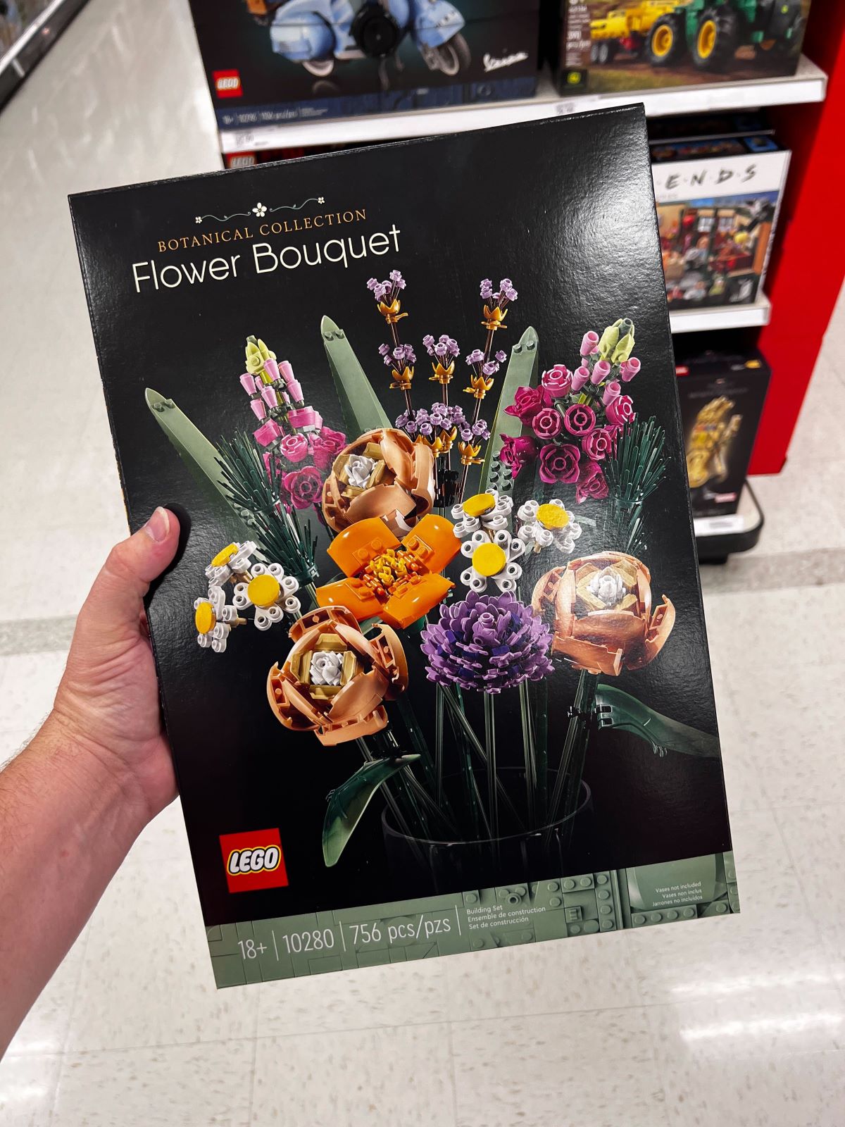 hand holding a LEGO flower bouquet