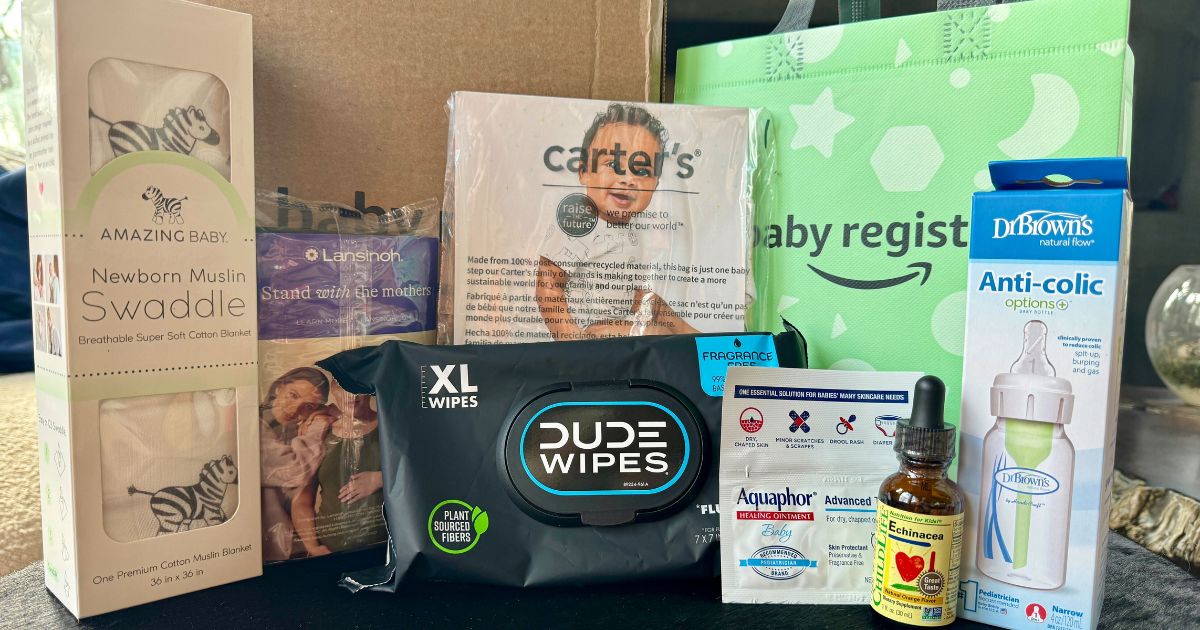 Amazon Baby Registry baby swaddle, pack of Dude Wipes, Amazon baby registry bag, baby vitamins, and Carter's onesie - The Freebie Guy