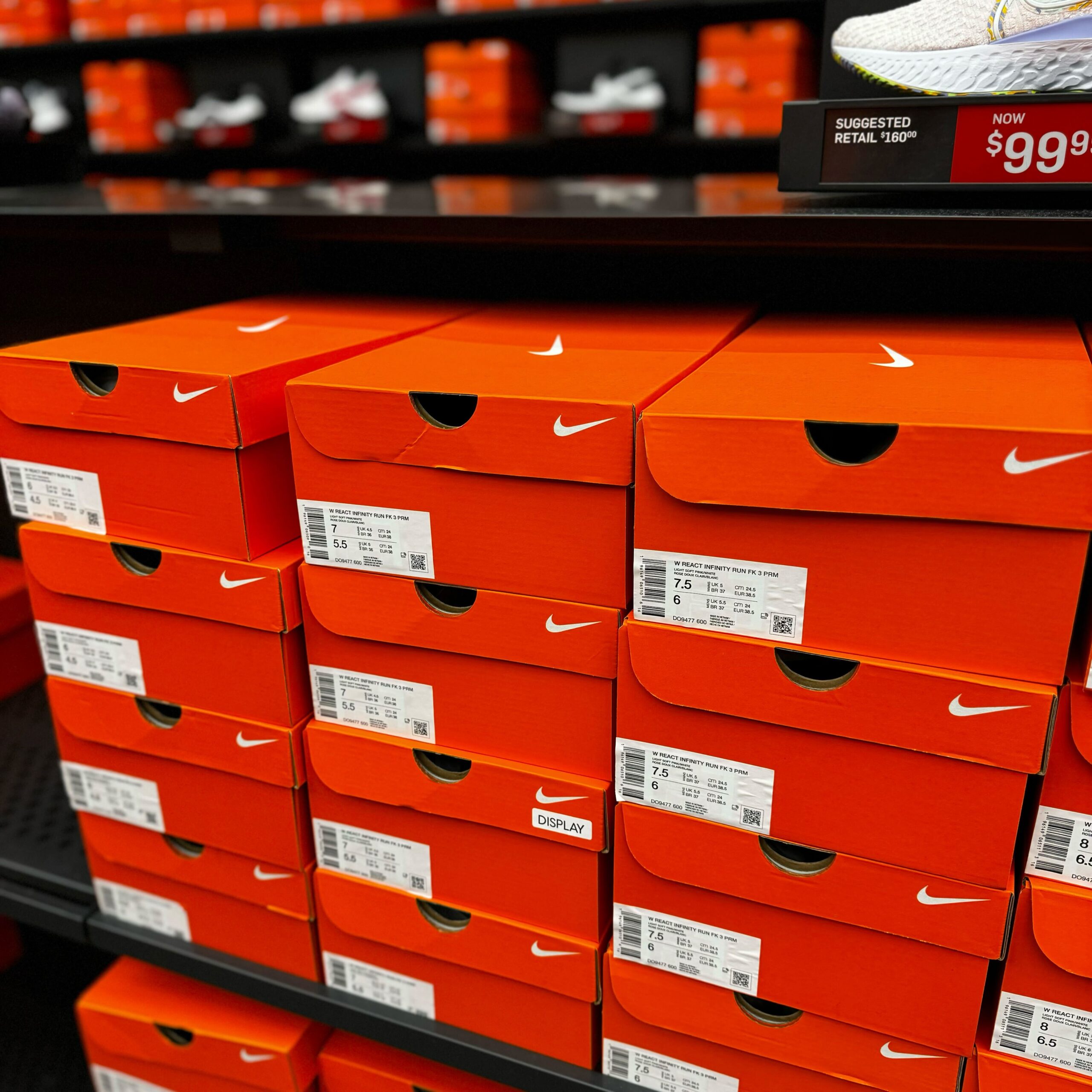 Stack of Orange Nike Shoe Boxes