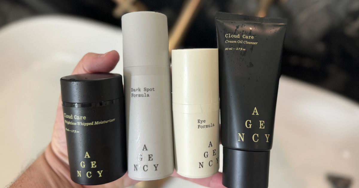 hand holding mutliple Agency Skincare products