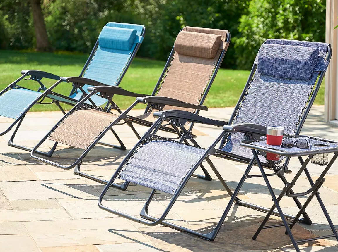 row of Kohl s Zero Gravity Chairs by a pool