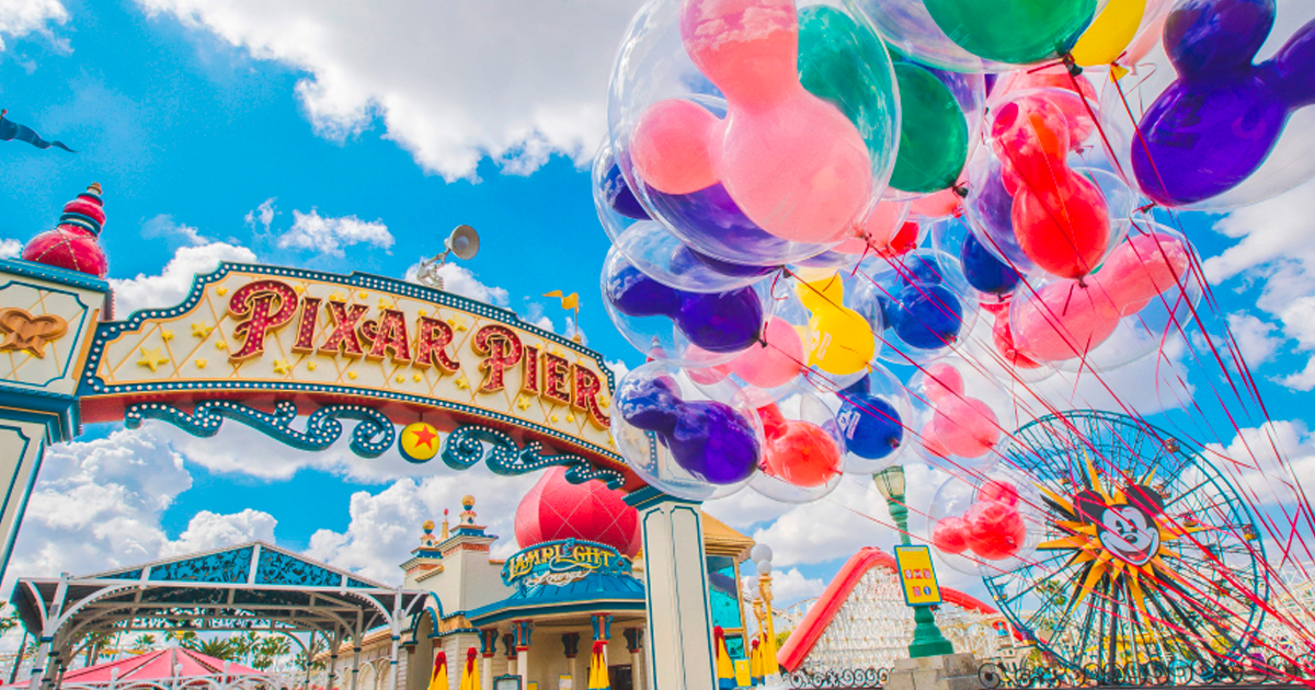the pixar pier with mickey ear balloons