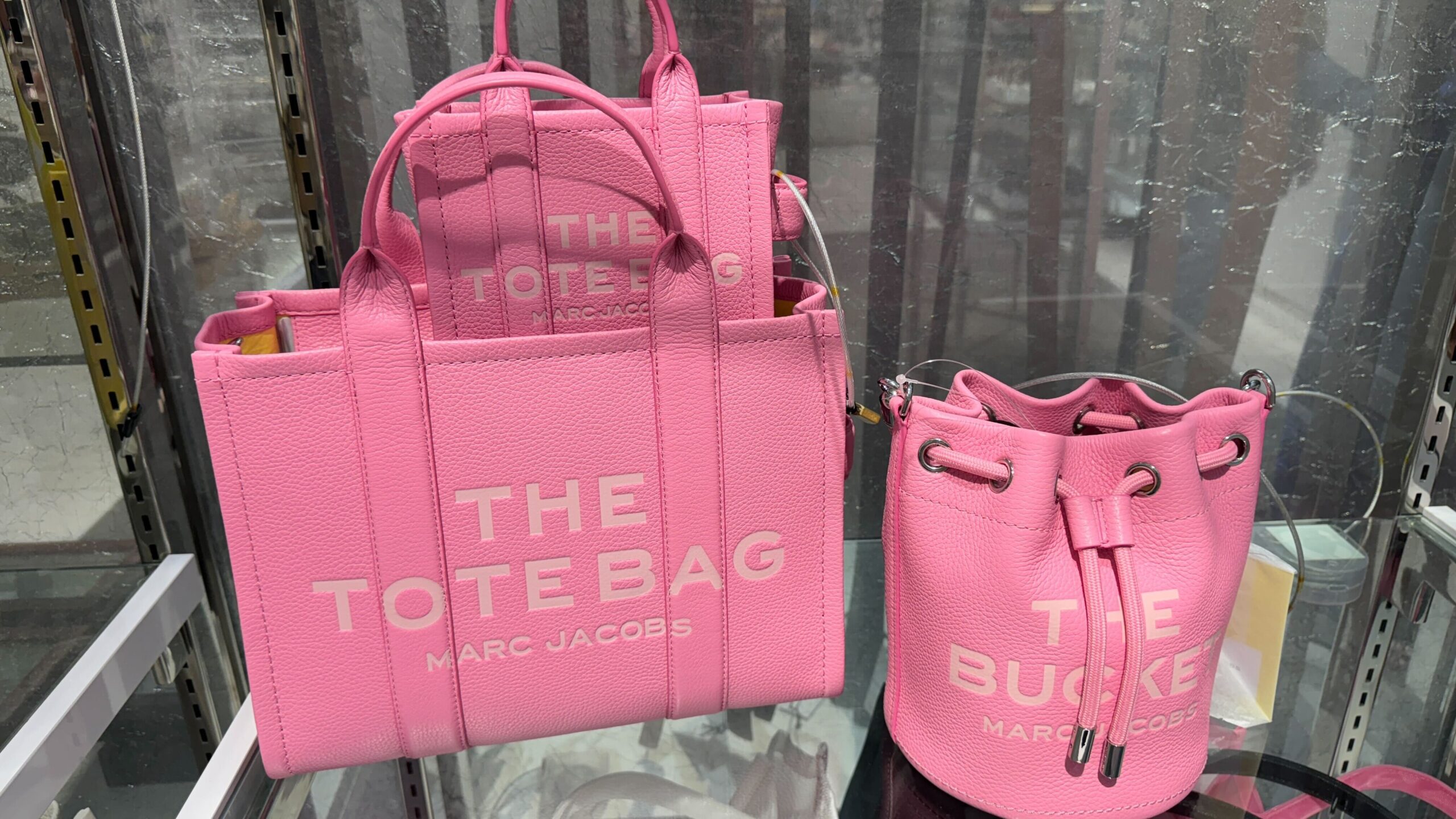 IMG pink marc jacobs the tote bags sitting on a shelf