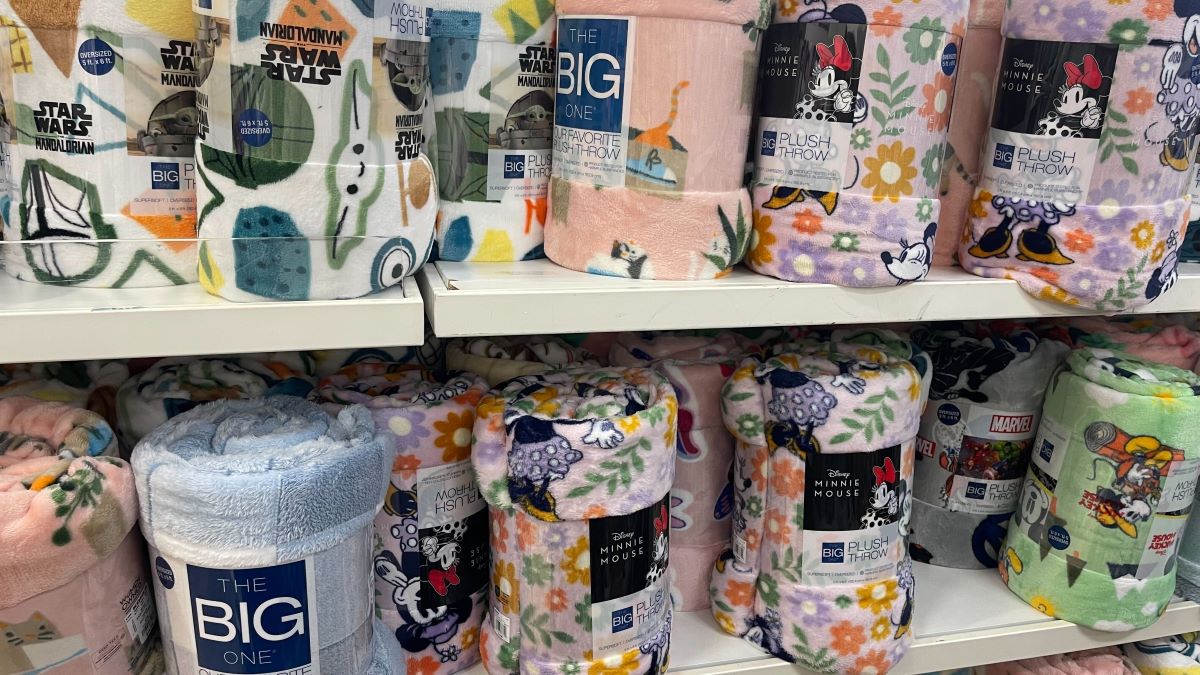 two shelves of throw blankets at Kohl's