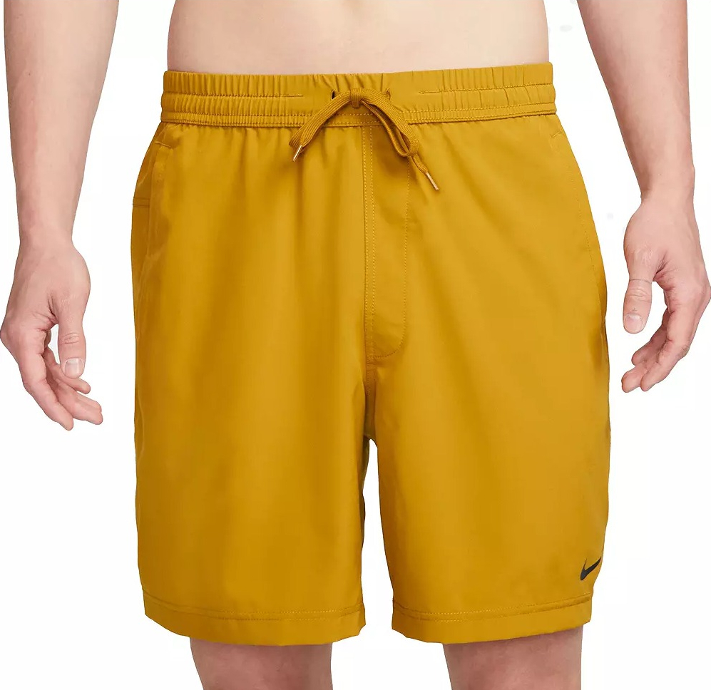 man wearing mustard colored shorts