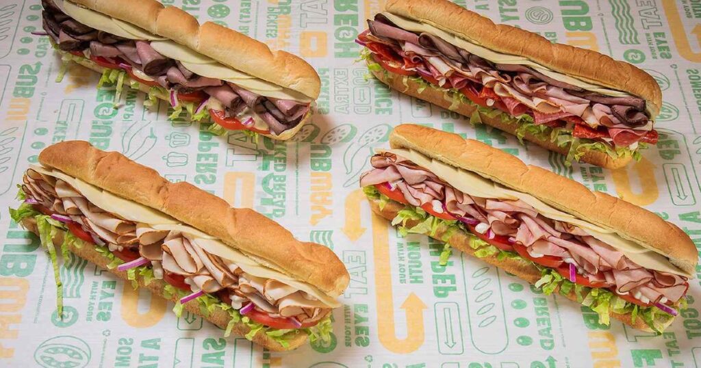 subway footlong four subway footlong sandwiches on subway brand paper