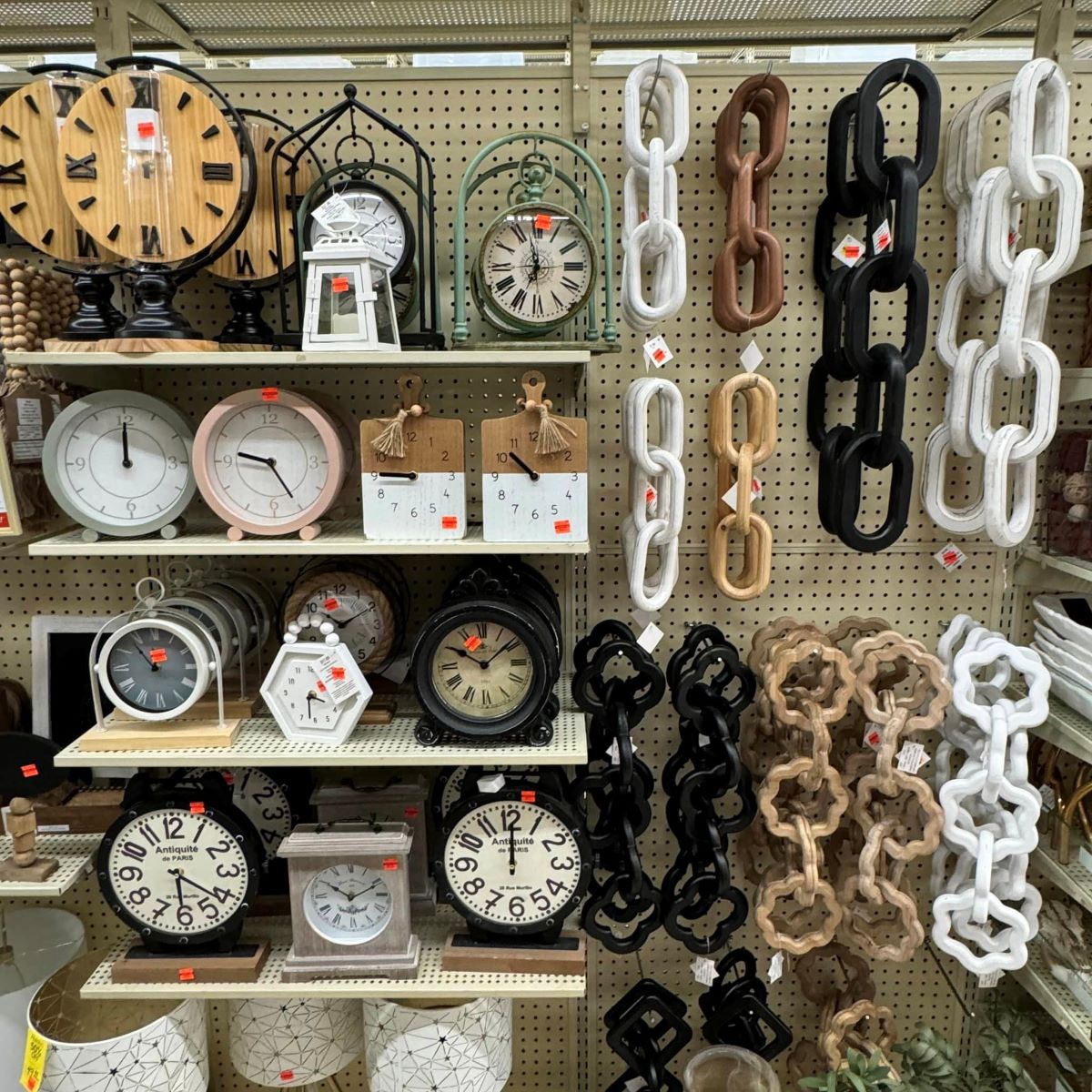 display of wall clocks and decorative chains