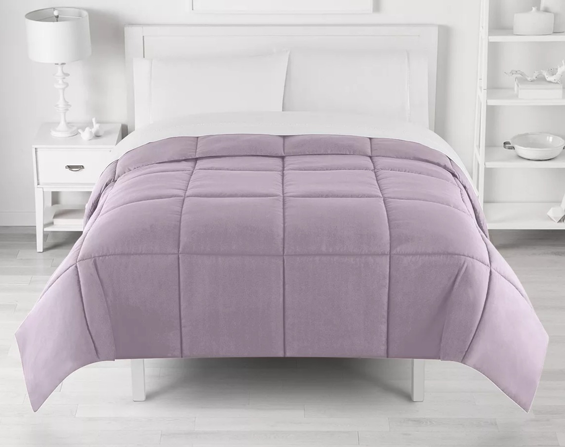 The Big One Comforter purple comforter on a bed