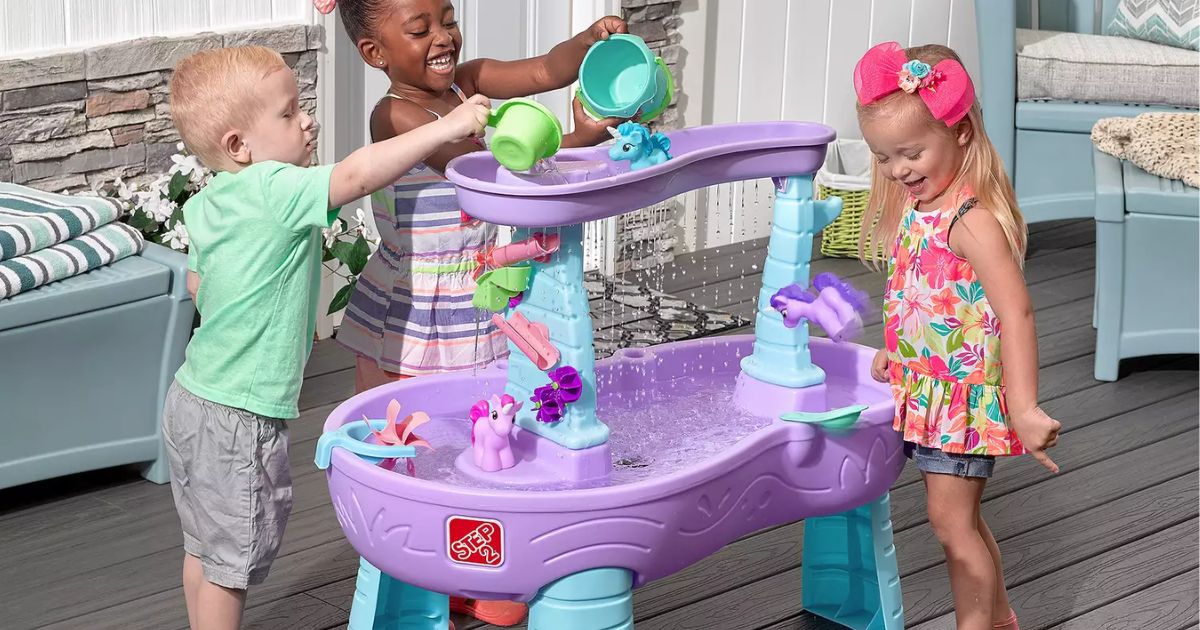 kids playing at a water table