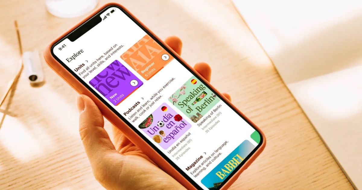 hand holding a phone with the Babbel app on it