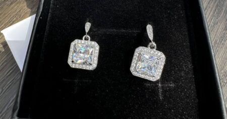 pair of earrings in a black box