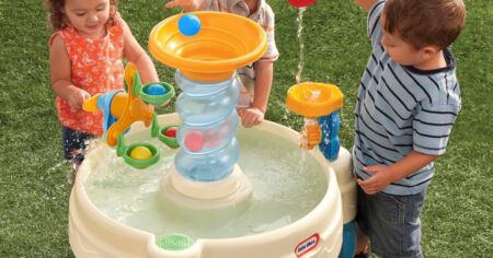 kids playing at a water table