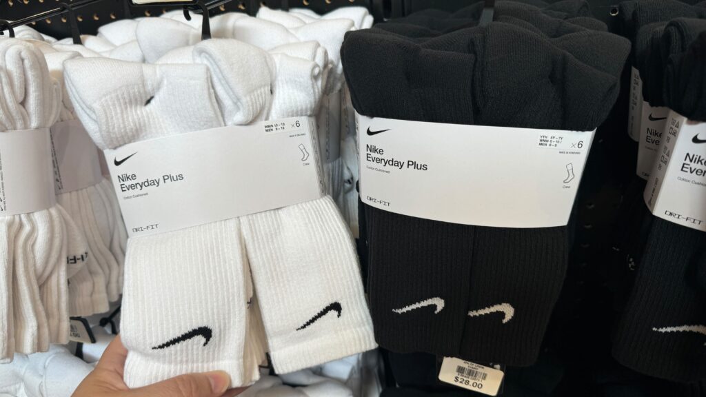 hand holding a pack of Nike socks