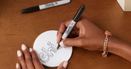 person using a Sharpie marker