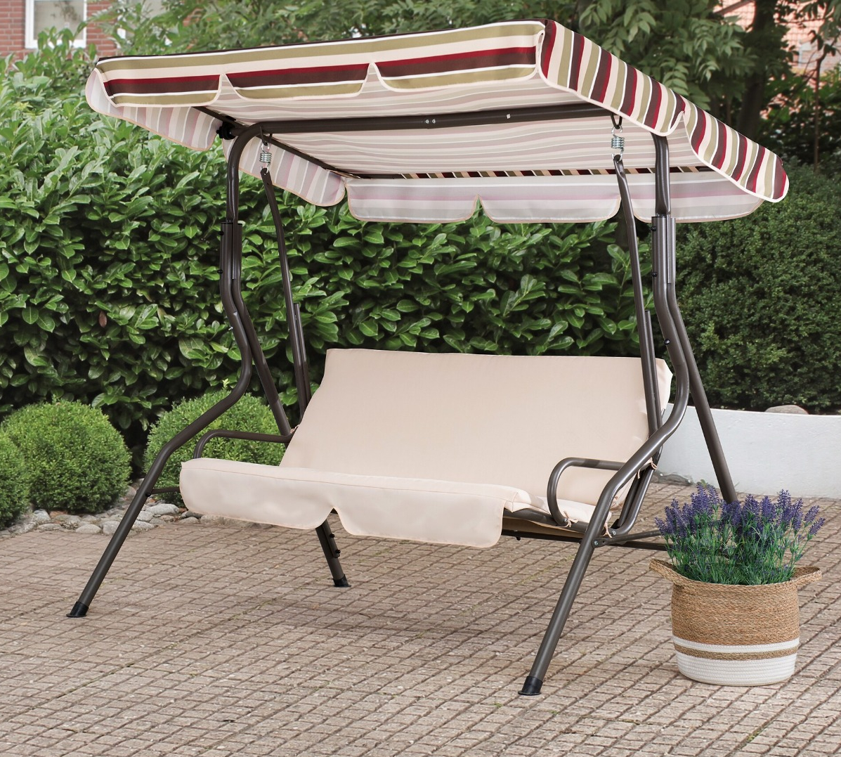 tan swing with red and tan striped awning