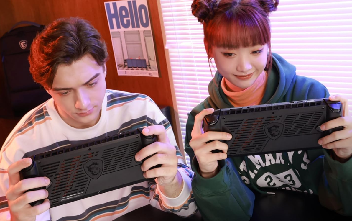 MSI Claw PC Gaming Handheld two people holding an MSI claw gaming console