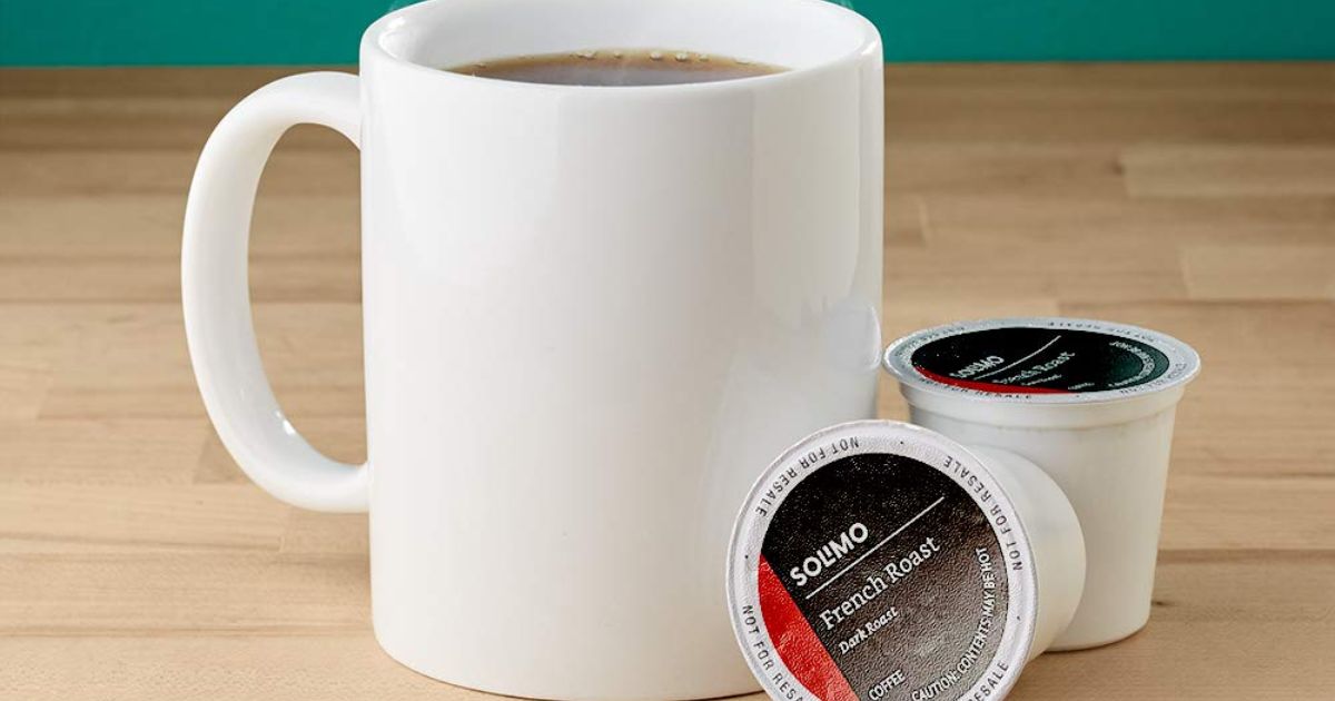 coffee pods next to a coffee mug