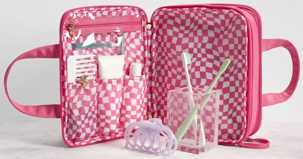 pink beauty bag with travel supplies in it
