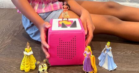 Tonies figures next to and on a Tonie box