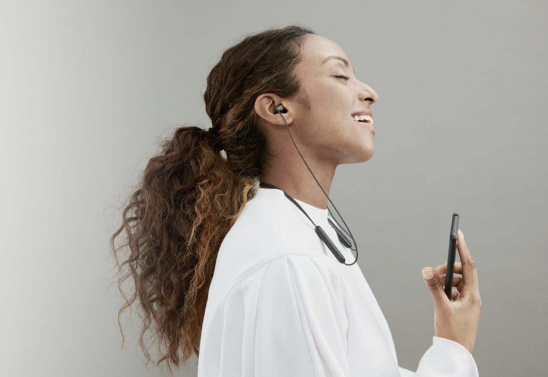 woman wearing earbuds