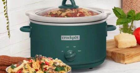 green Crock-pot with a bowl of food next to it