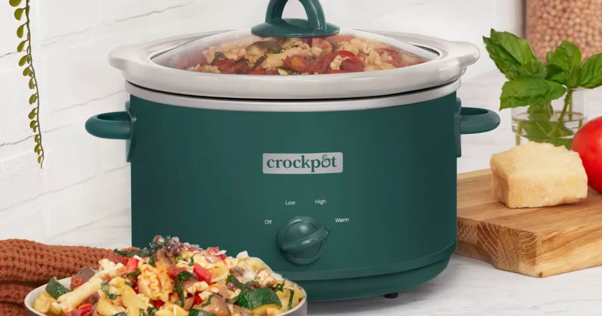 green Crock-pot with a bowl of food next to it