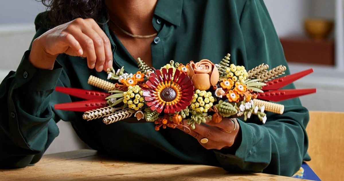 woman holding a LEGO flowers set