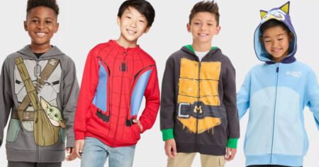 row of boys wearing costume hoodies