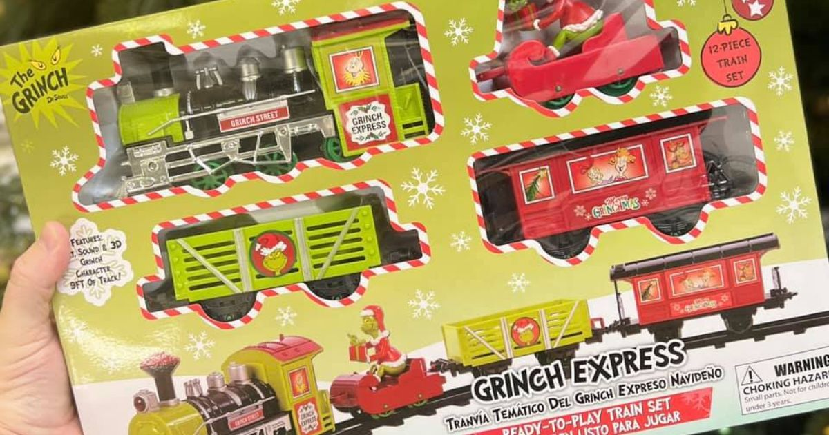 hand holding a Grinch Express Train Set