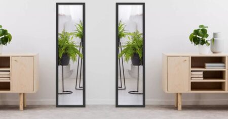 two mirrors next to tables