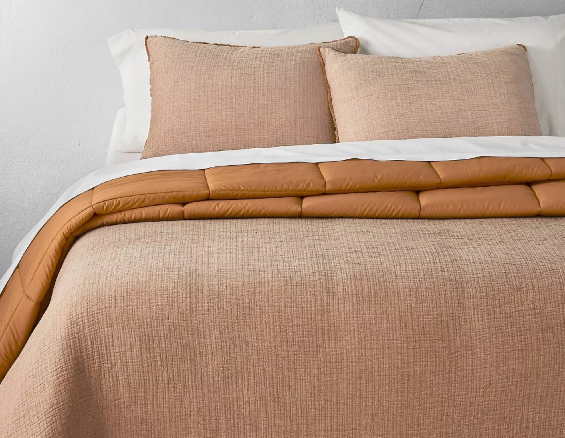 Textured Chambray Cotton Comforter Sham Set King bed with an orange comforter on it