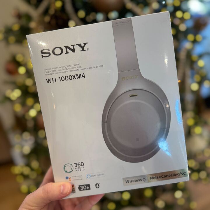 box of sony headphones in front of a christmas tree