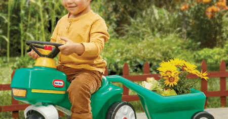 boy riding on a Little Tikes Tractor