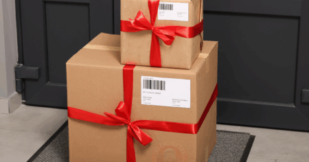 Boxes Wrapped in a Bow on a DoorStep