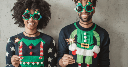 Two People Wearing Christmas Sweaters