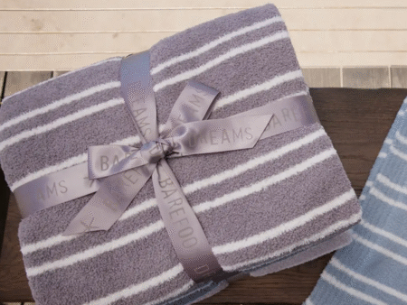 Barefoot Dreams throw on table