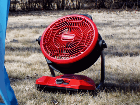 Craftsman industrial fan on grass near tent