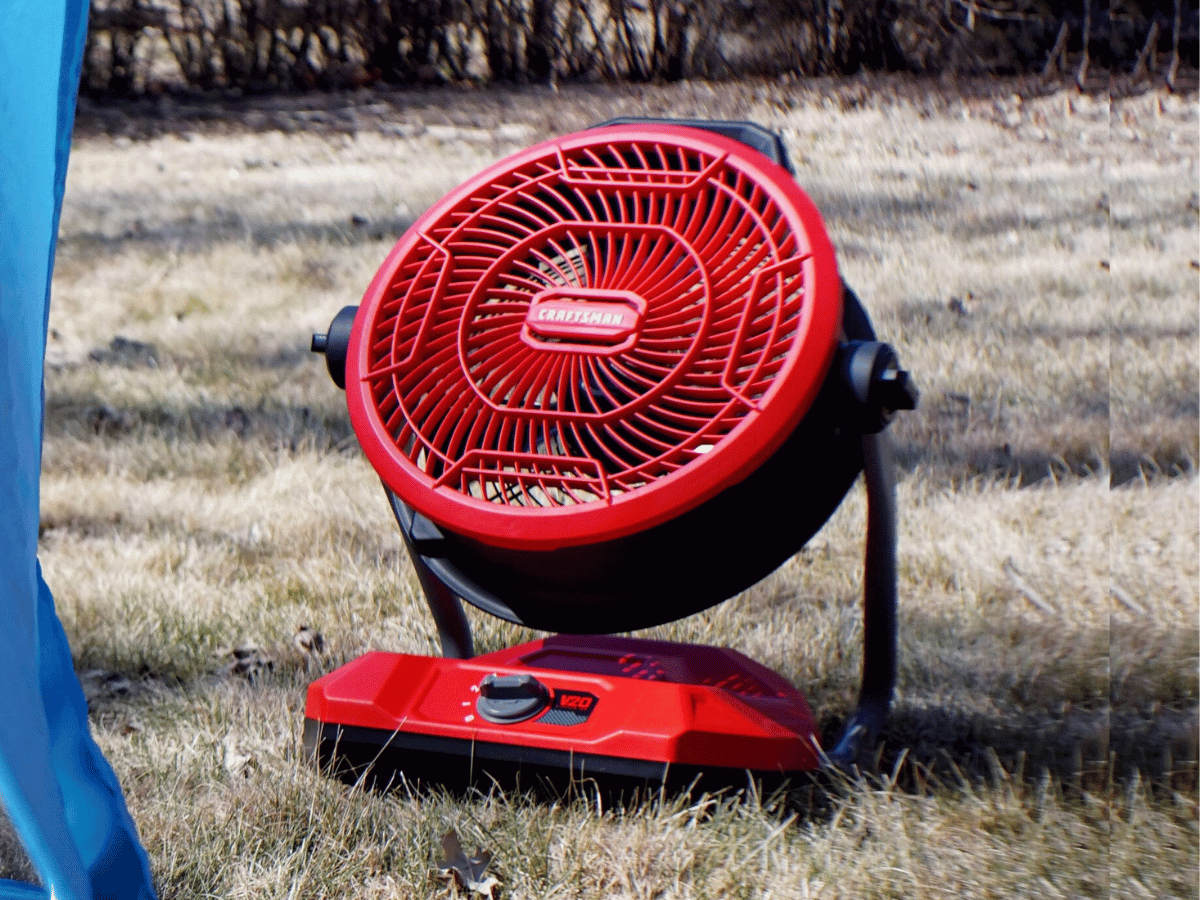 Craftsman industrial fan on grass near tent