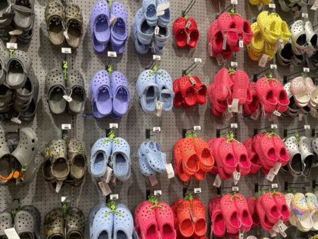 Crocs hanging on store pegs