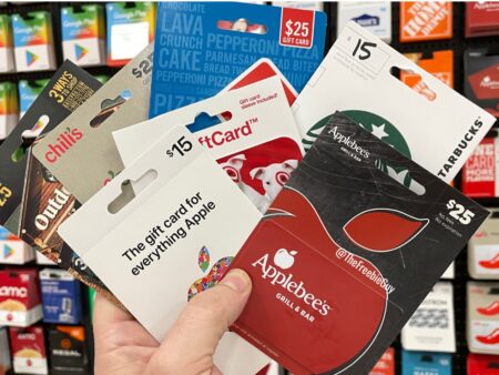 Hand holding assorted gift cards